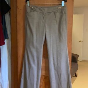 Beige slacks with gold buckle detail